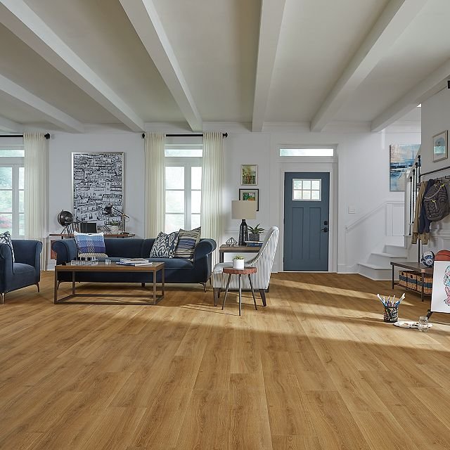 Large living room with warm colored hardwood flooring